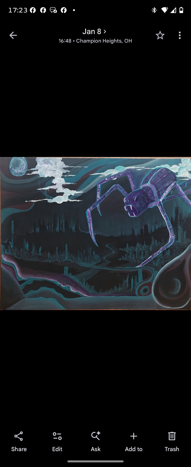 A giant purple spider over a dark blue landscape beneath a moon and drifting clouds